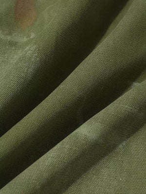 Green distressed cargo pants with subtle accents and textured polyester-spandex fabric.