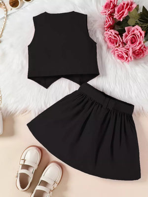 Black baby bowknot vest and pleated skirt set with bow detail on skirt.