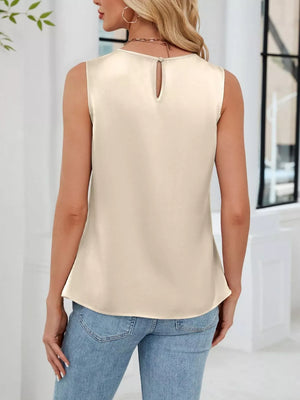 Apricot pleated round neck sleeveless tank top with keyhole button closure at back.