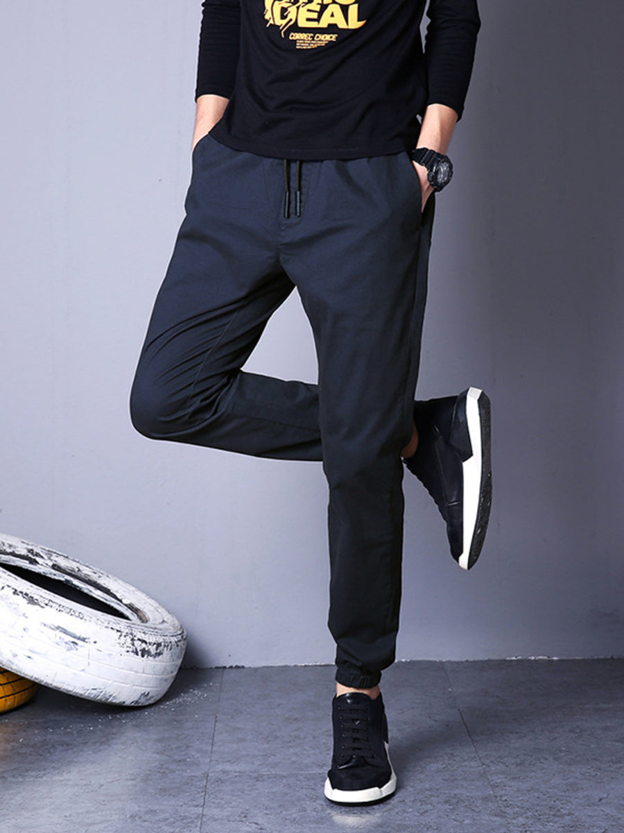 Men's black drawstring pants, tapered fit, cuffed ankles