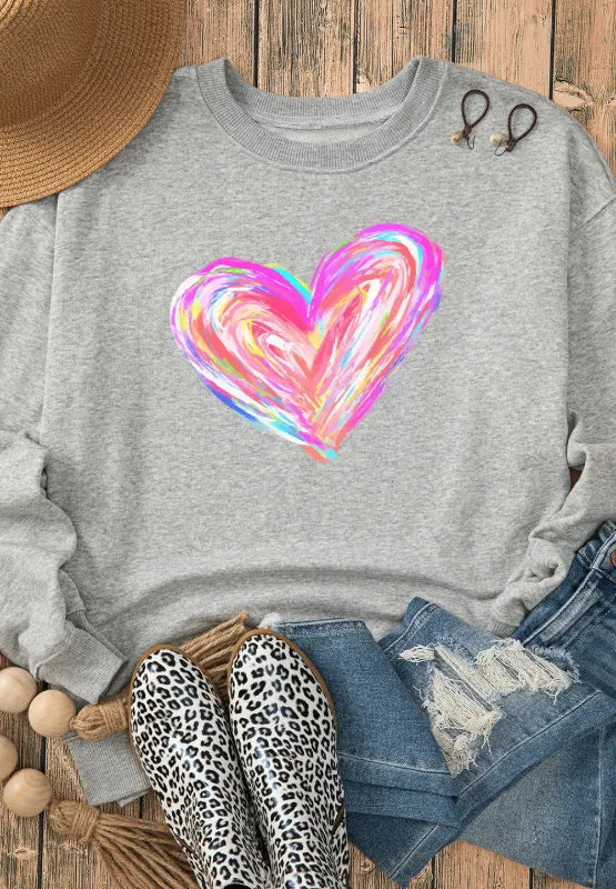 Gray crewneck sweatshirt with a colorful painted heart graphic.