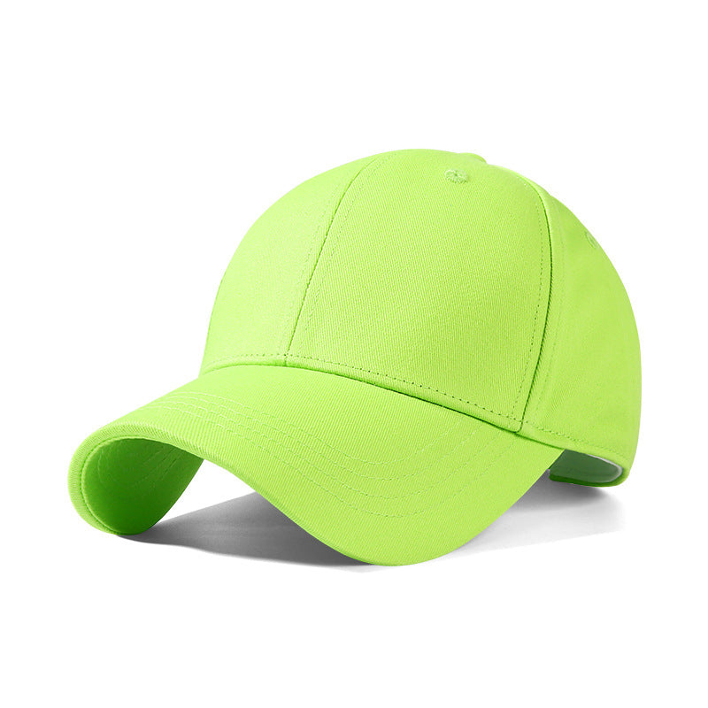 Minimalist cotton baseball cap in fluorescent green with a curved brim.