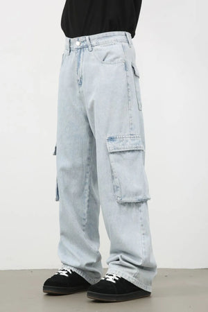 Oversized light wash denim cargo pants with multiple pockets.