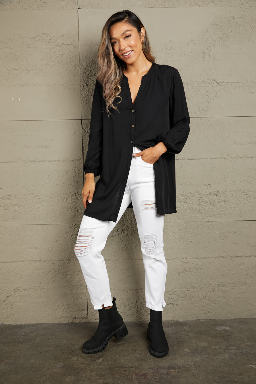 Black oversized mandarin collar blouse with button front and balloon sleeves.