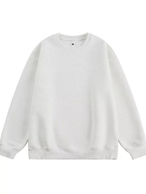 Oversized crew-neck sweatshirt in white, featuring a relaxed fit and ribbed cuffs and hem.