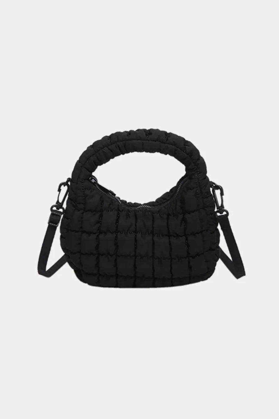 Black padded crescent crossbody bag with sculptural texture and top handle.