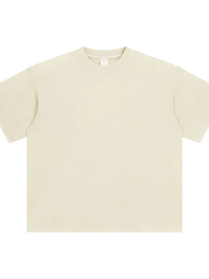 Oversized washed cotton crewneck t-shirt in beige with a relaxed fit and crew neckline.
