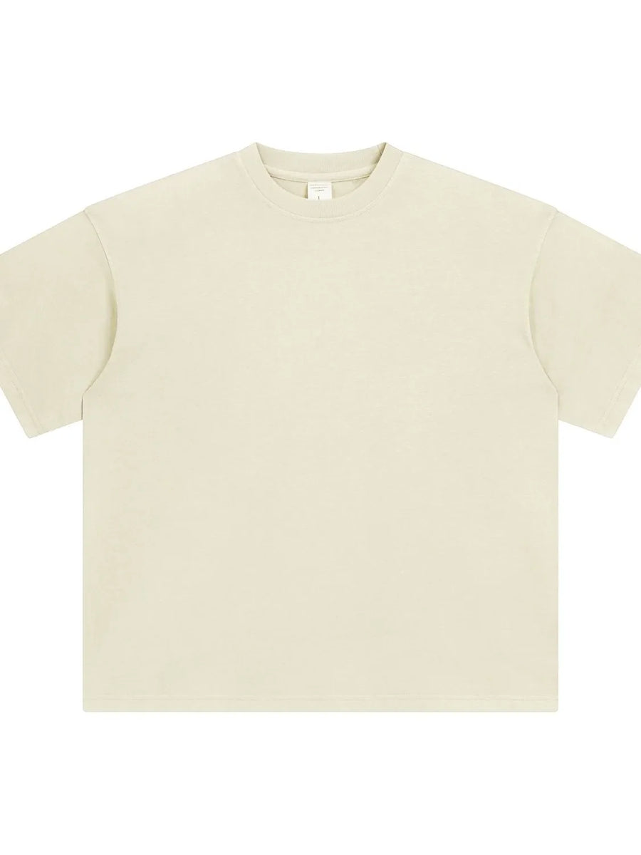 Oversized washed cotton crewneck t-shirt in beige with a relaxed fit and crew neckline.