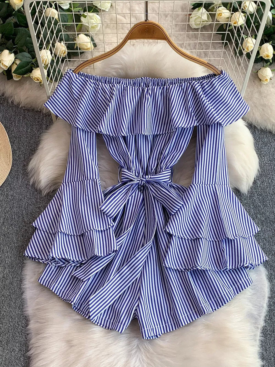 Blue striped off-shoulder romper with ruffled tiers and a bow belt.