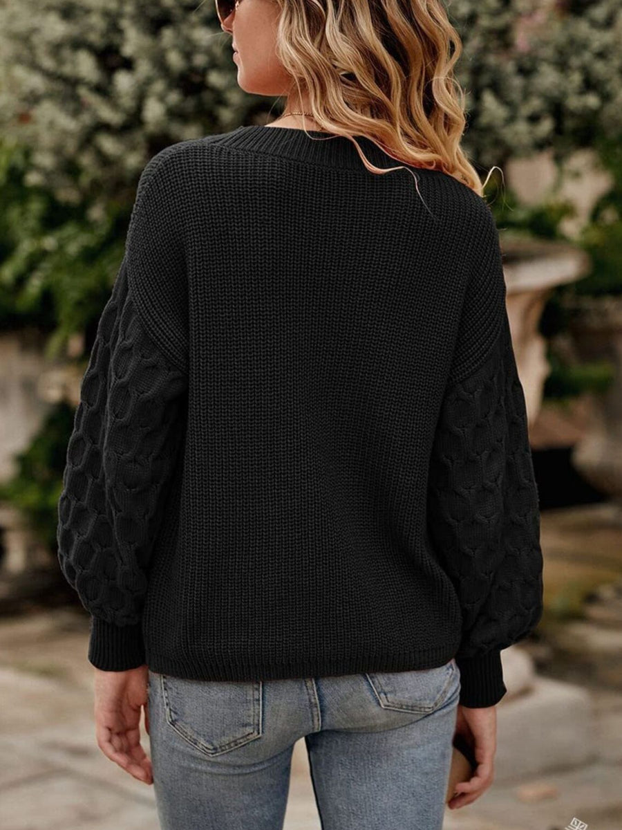 Blue pullover sweater with textured sleeves and long sleeve