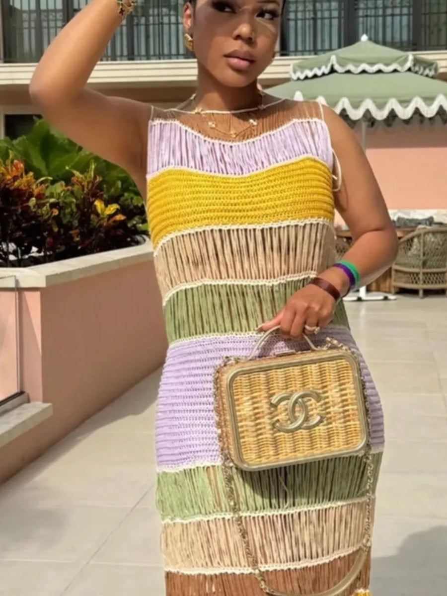Vibrant knit maxi dress with fringe detail and color block stripes in purple, yellow, and green.