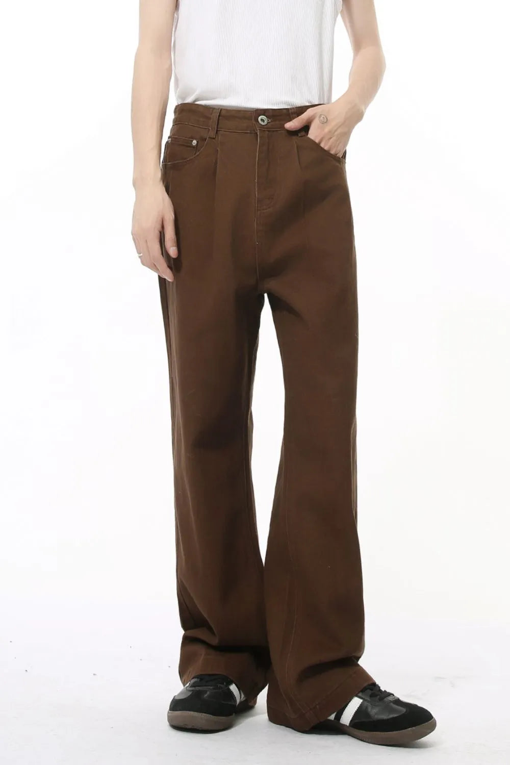 Chocolate wide-leg denim trousers with front pleats and a relaxed fit.