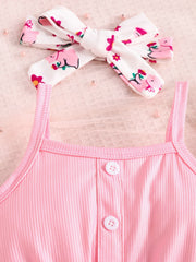 Pink ribbed tank top with button detail and matching printed headband.