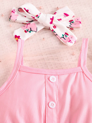 Pink ribbed tank top with button detail and matching printed headband.