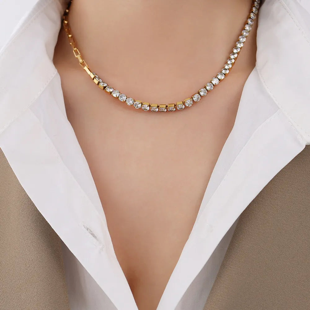 Gold half-and-half pavé chain necklace with clear stones and link chain detail.