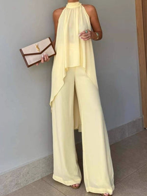 two-piece set in pale yellow featuring high-low and relaxed top with wide-leg pants fit