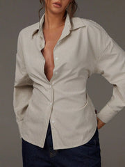 white button-down shirt with button cuffs and long sleeve