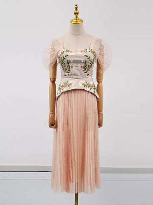Pink embroidered tulle midi dress with sheer puff sleeves and square neckline.