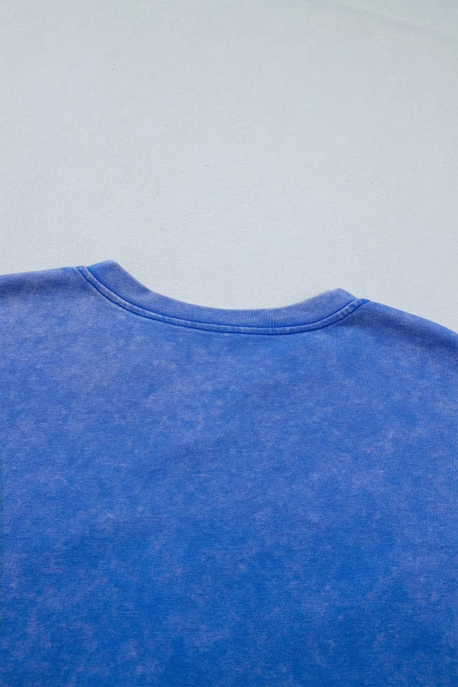 Blue cotton t-shirt with washed effect and notched neckline detail