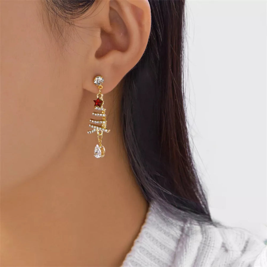 clear earrings featuring dangle style and christmas tree motif