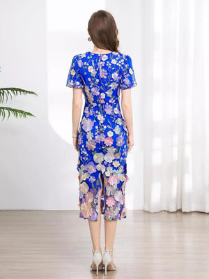 Blue floral embroidered midi dress with short sleeves and a slit hem