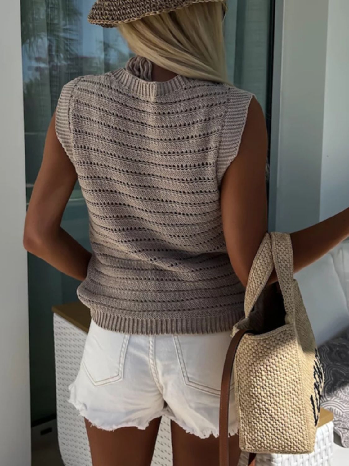 Beige open-stitch sleeveless knit tank top with horizontal stripe pattern and mock neck.