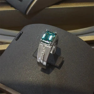 Silver ring with emerald cut moissanite and small diamonds, architectural design