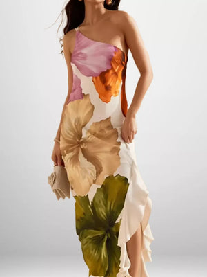 Elegant floral one-shoulder maxi dress in polyester with ruffled hem and large botanical print.