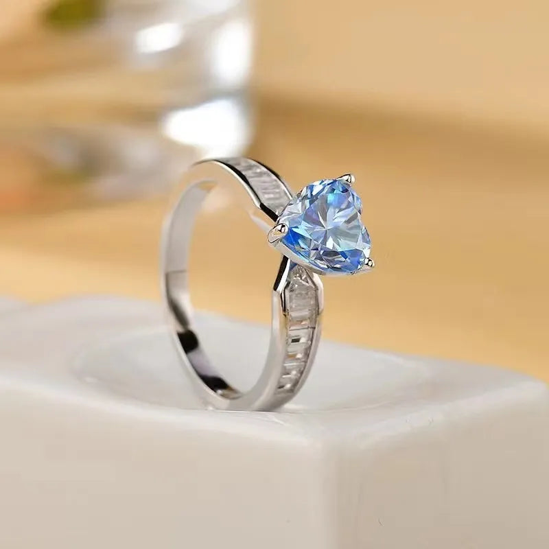 Silver ring with heart-cut aquamarine and baguette accents
