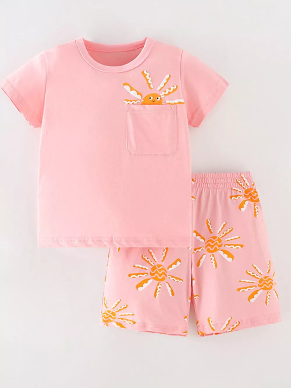 Pink cotton toddler top and shorts set with sun print and pocket detail