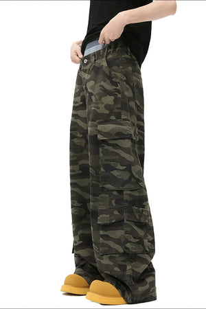 Wide-leg cargo pants in green camouflage with multiple utility pockets.