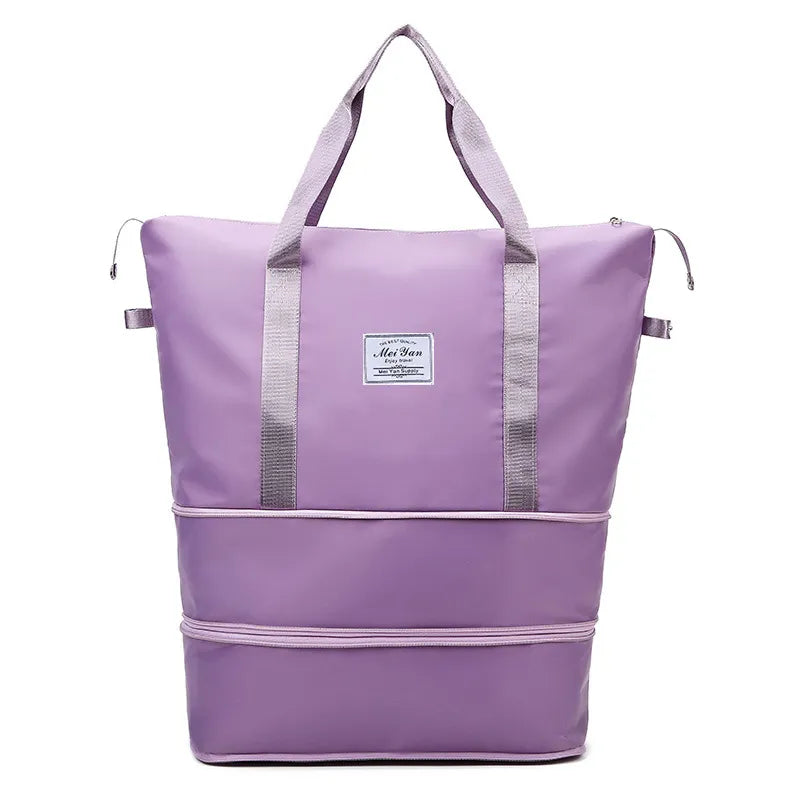 Expandable travel tote bag in lavender with contrast trim and dual handles.