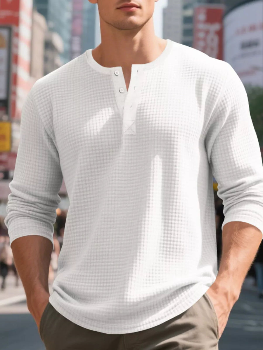 White waffle knit henley t-shirt with button placket and long sleeves.