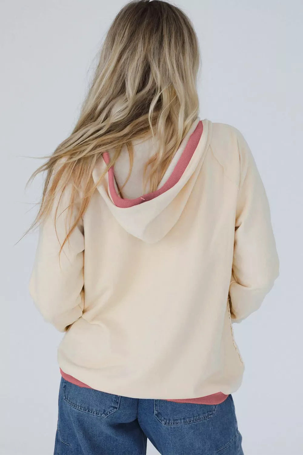 65% polyester, 35% cotton Care instructions: Machine wash cold pullover hoodie in White with relaxed silhouette