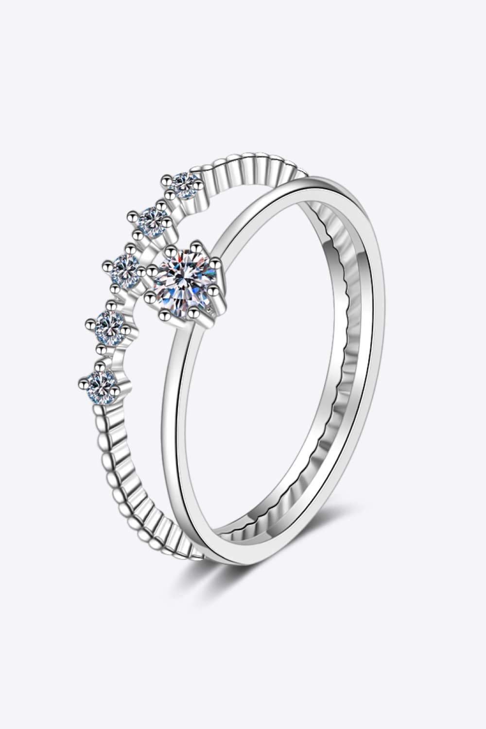 Silver layered ring set with moissanite stones and beaded detail.