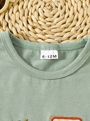 Light green cotton baby tee with embroidered tractor detail and crew neck.