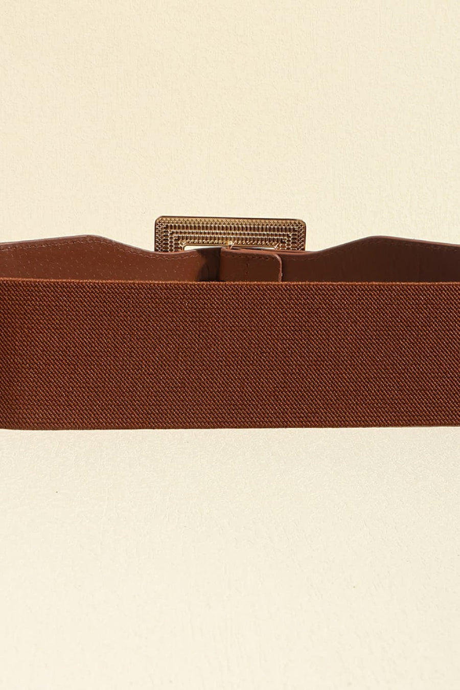 Brown elasticated waist belt with textured gold buckle detail