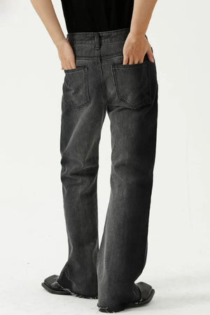 Dark wash cotton flare jeans with raw hem and seam details