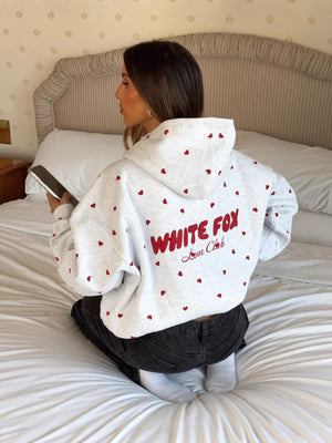 100% polyester Care instructions: Machine wash cold pullover hoodie in White with oversized silhouette