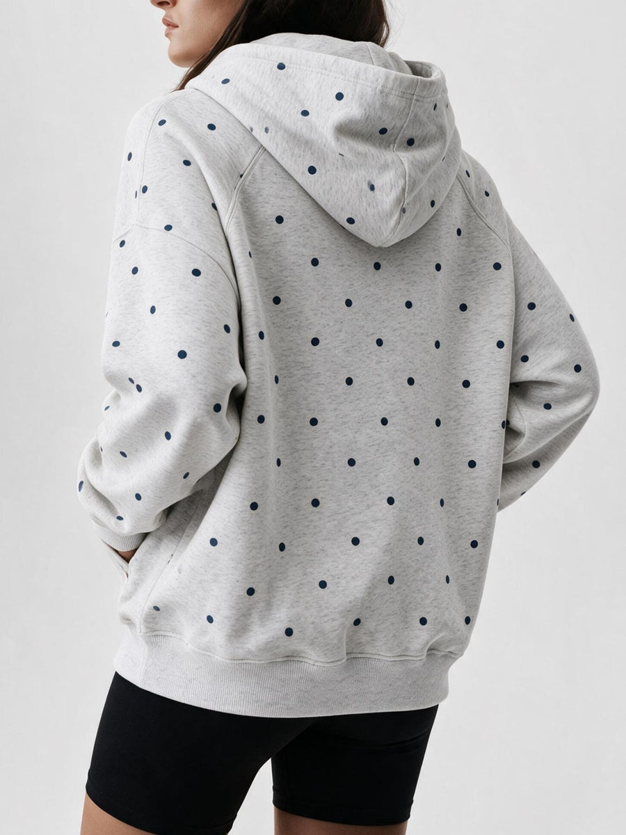 navy blue pullover hoodie featuring pocketed and polka dot
