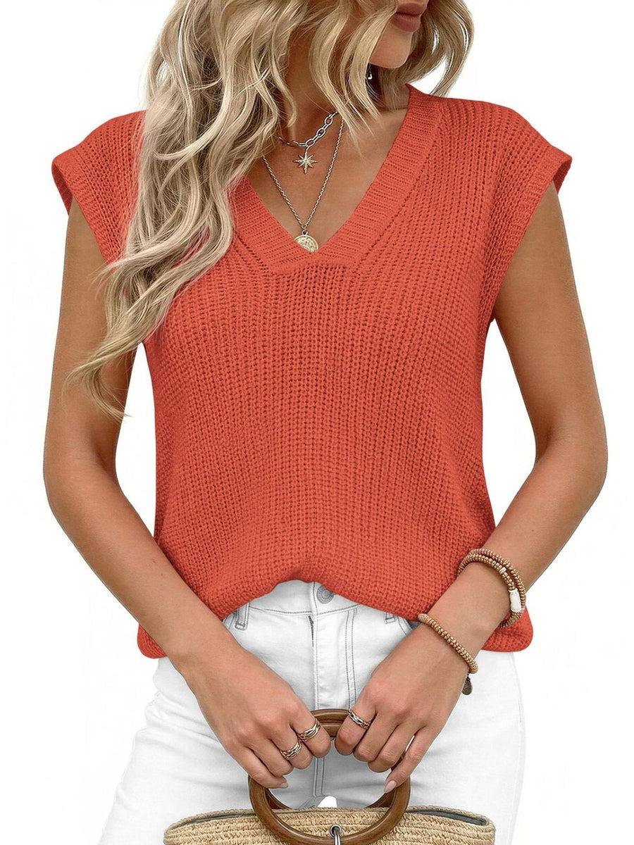Textured apricot V-neck sweater vest with cap sleeves.