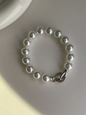 White pearl beaded bracelet with ornate clasp
