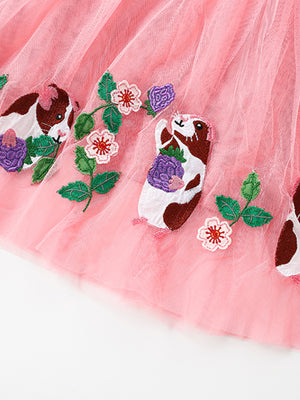 Pink tulle toddler dress with embroidered guinea pigs and flowers.