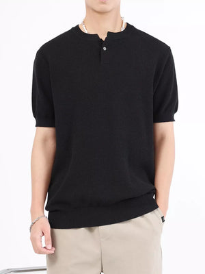 Men's black knit short sleeve henley t-shirt with button placket.