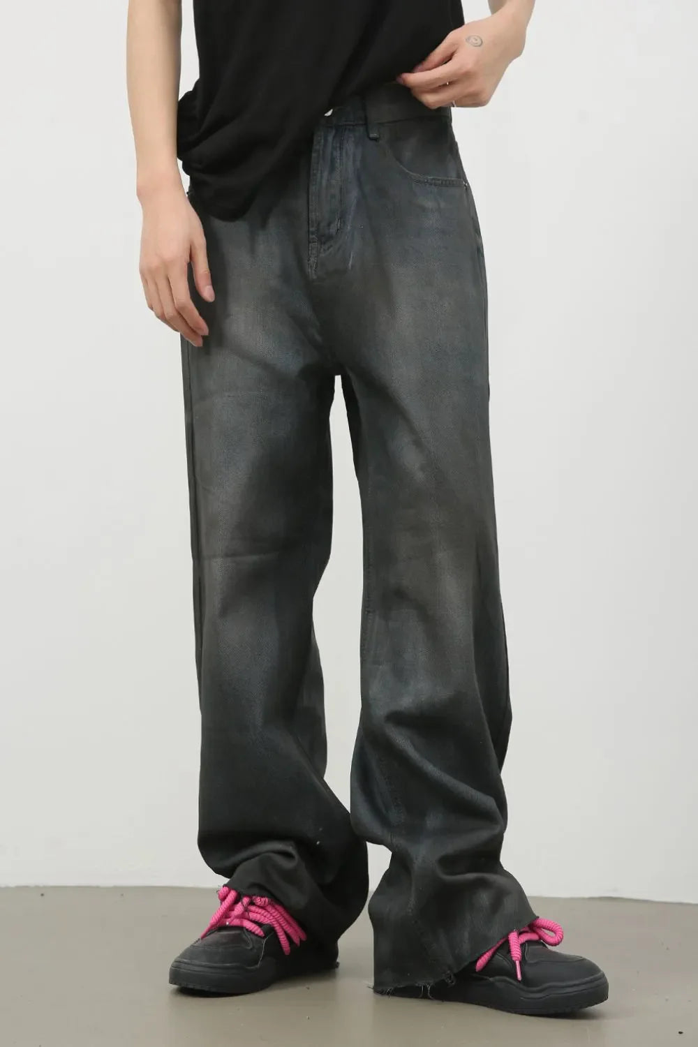 Washed dark denim wide-leg trousers with a relaxed fit.