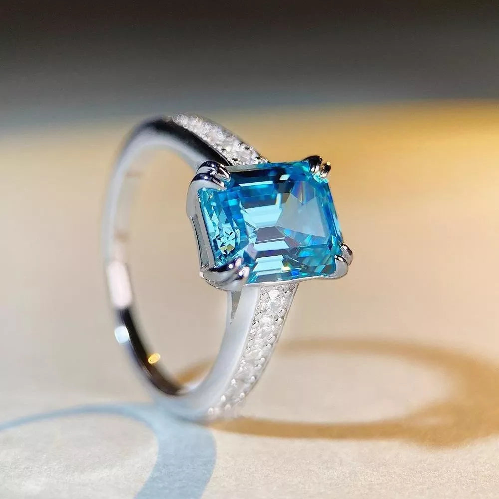 silver ring featuring main stone and geometric