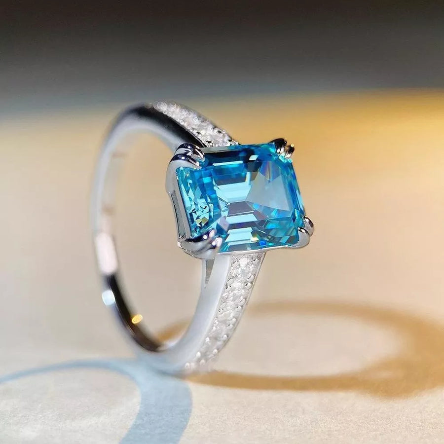silver ring featuring main stone and geometric