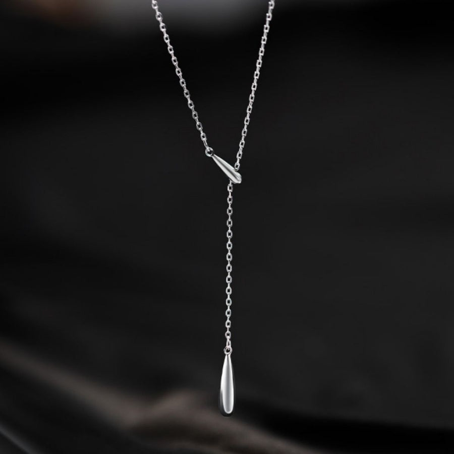 Silver Y-shaped pendant necklace with a long drop and a small bar accent.