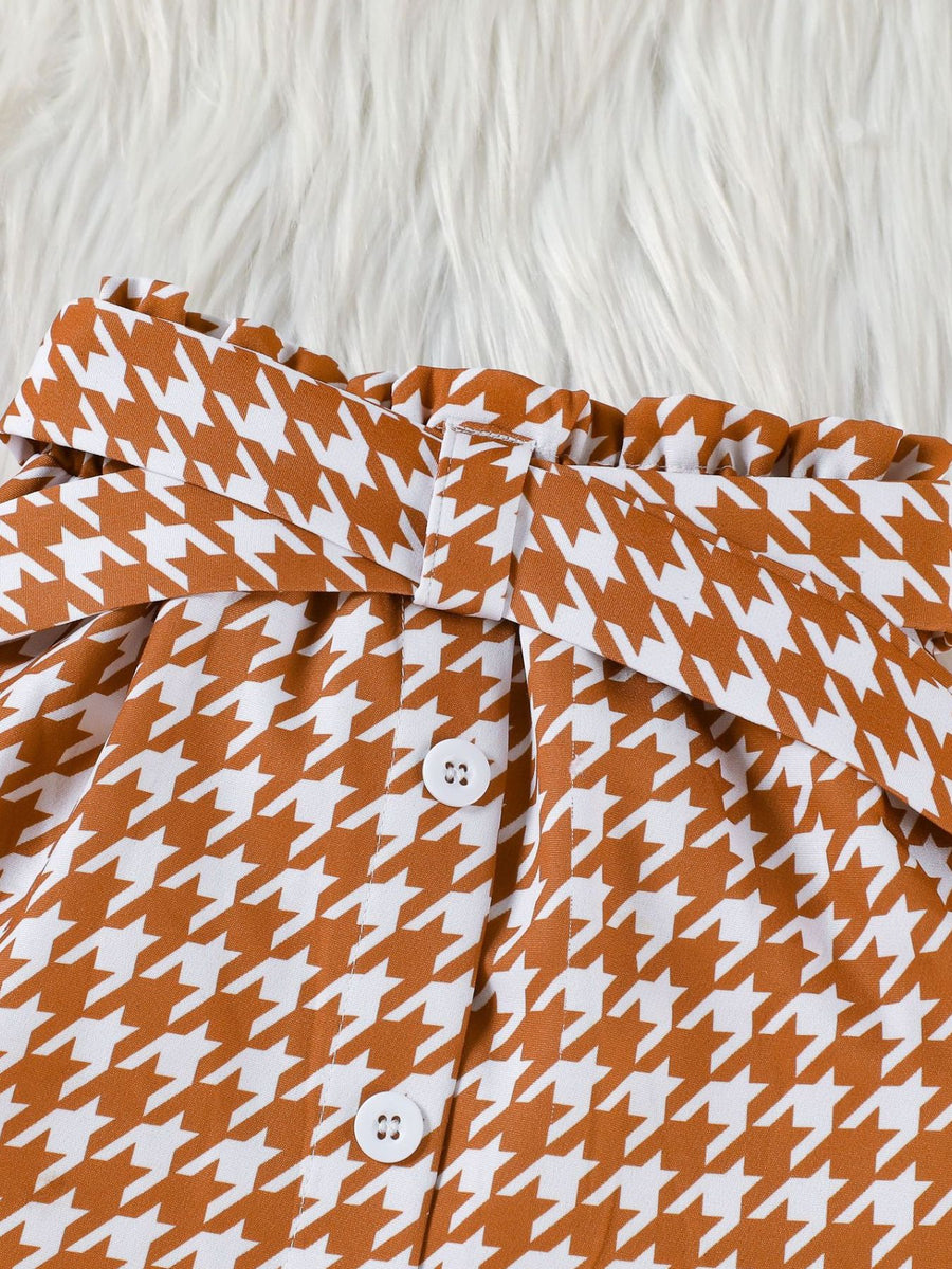 Toddler houndstooth skirt with paperbag waist, tie belt, and button details.