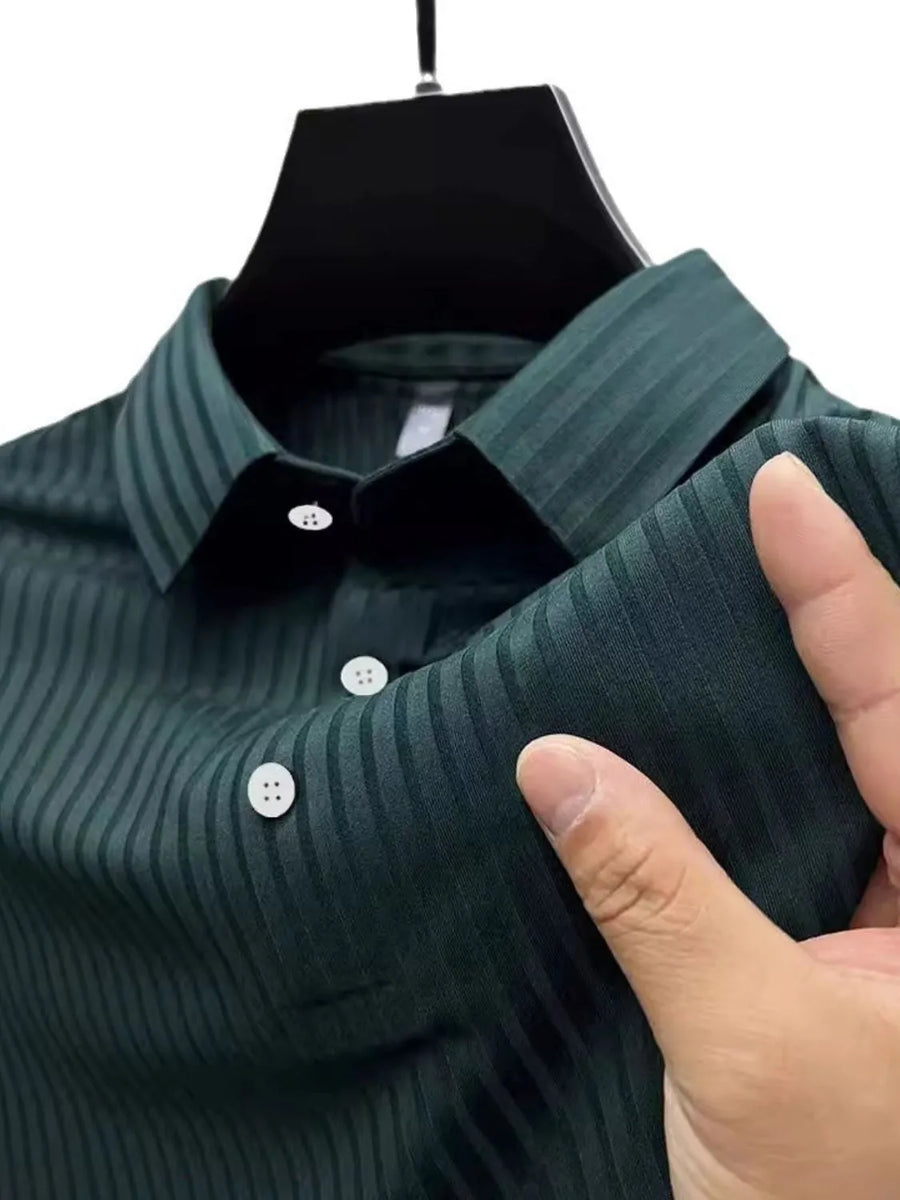 Textured ribbed polo shirt in Black Forest with buttoned collar and cuffs.